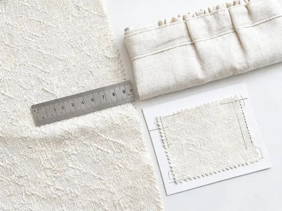 Cotton drapery fabric beside a finished window-treatment header